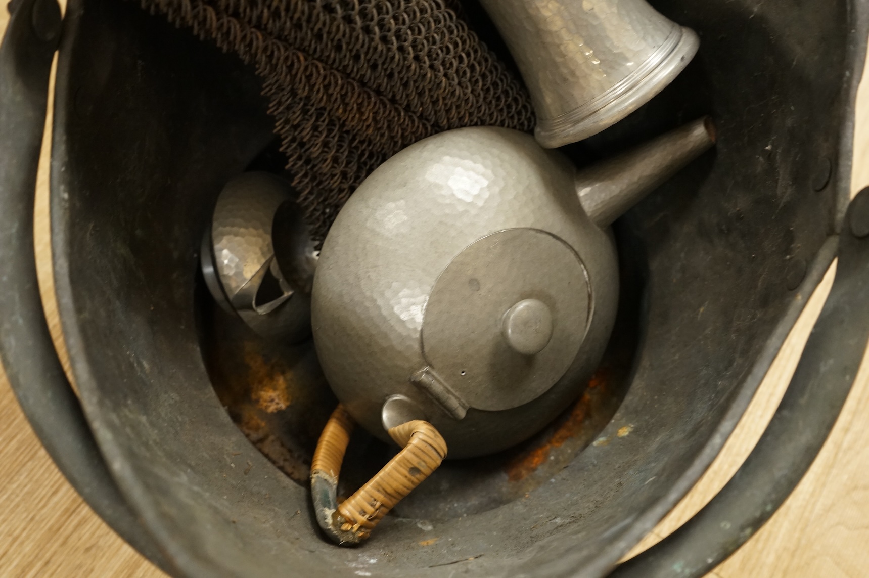 A Hutton, Sheffield English Pewter tea set comprising a teapot, 8cm high, jug and sugar bowl, together with salt and pepper shakers by other makers, a copper coal scuttle and two American mesh fire screens, coal scuttle
